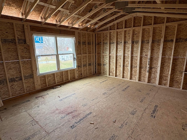 miscellaneous room with lofted ceiling