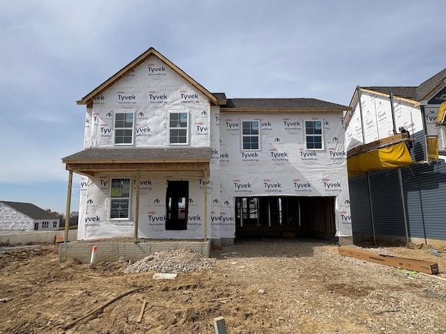 unfinished property with an attached garage