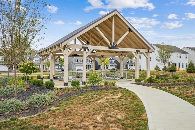 surrounding community with a residential view, a lawn, and a gazebo