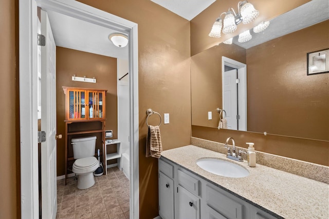 bathroom featuring toilet and vanity