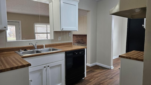 kitchen featuring backsplash, dark wood finished floors, black dishwasher, wood counters, and a sink