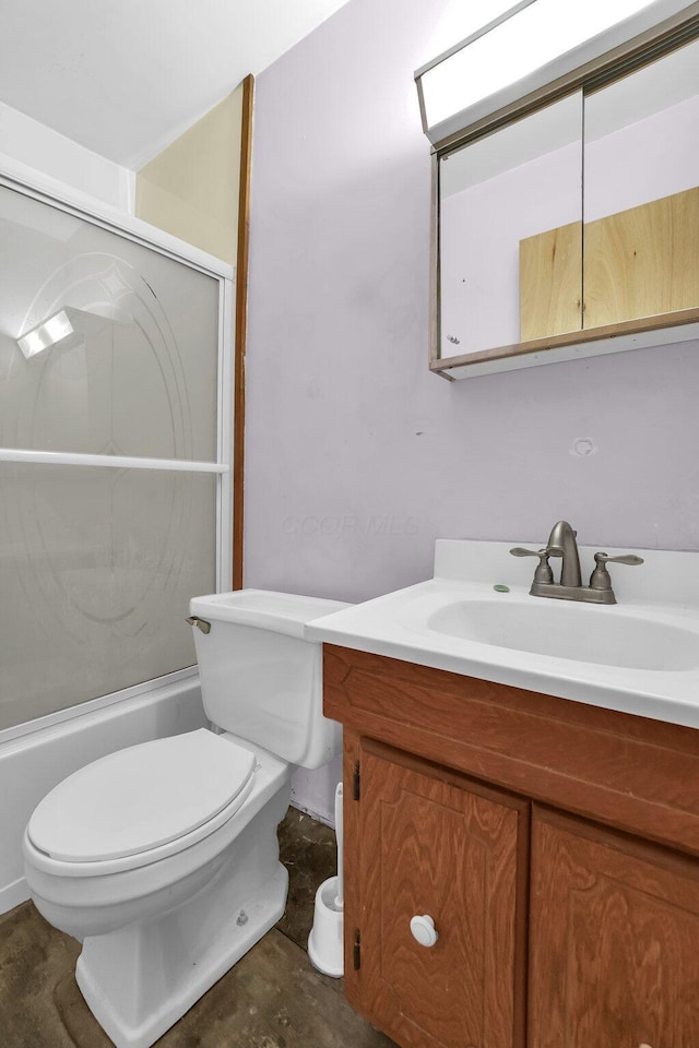 full bath featuring toilet, shower / bath combination with glass door, and vanity