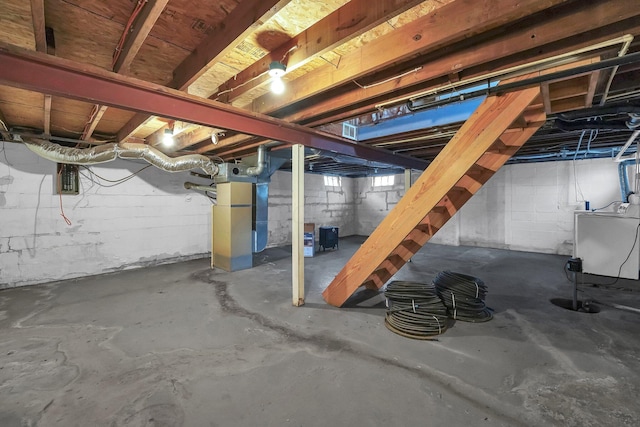 unfinished basement featuring washer / clothes dryer