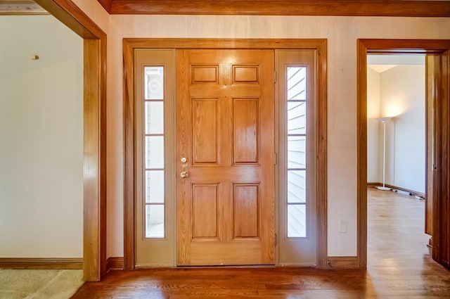 entrance foyer with wood finished floors and baseboards