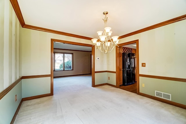 carpeted empty room with crown molding, a notable chandelier, baseboards, and visible vents