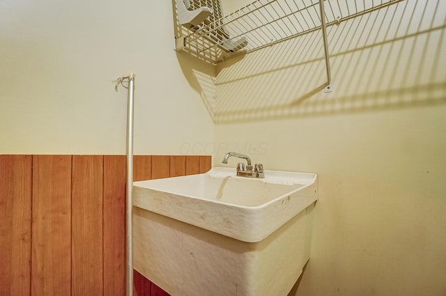 laundry room featuring a wainscoted wall