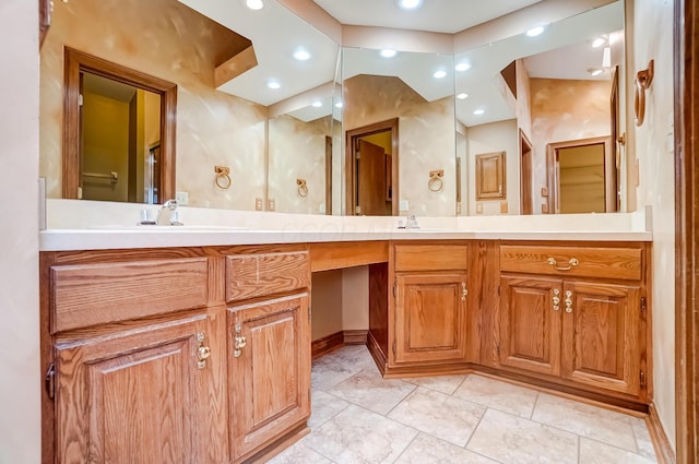 bathroom featuring recessed lighting and vanity