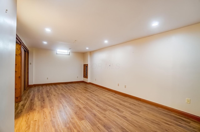 basement featuring recessed lighting, light wood-style flooring, and baseboards