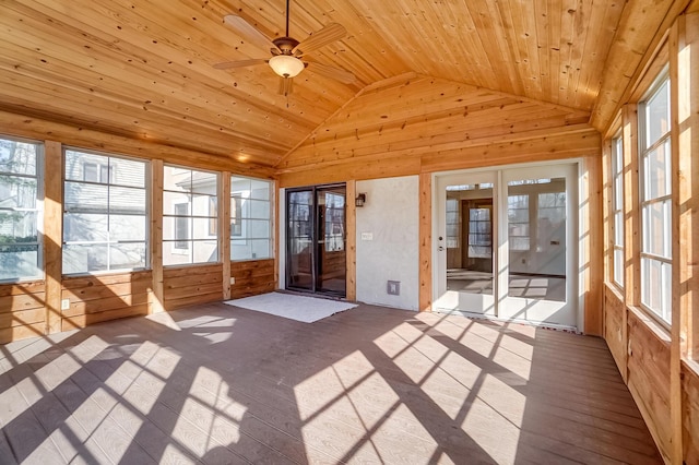 unfurnished sunroom with a healthy amount of sunlight, wooden ceiling, and vaulted ceiling