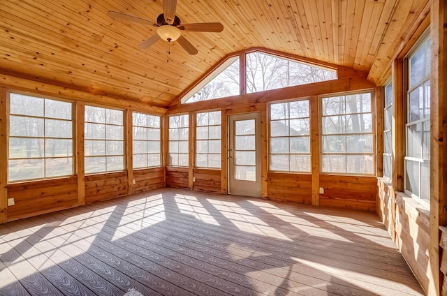 unfurnished sunroom featuring wood ceiling, vaulted ceiling, and a healthy amount of sunlight