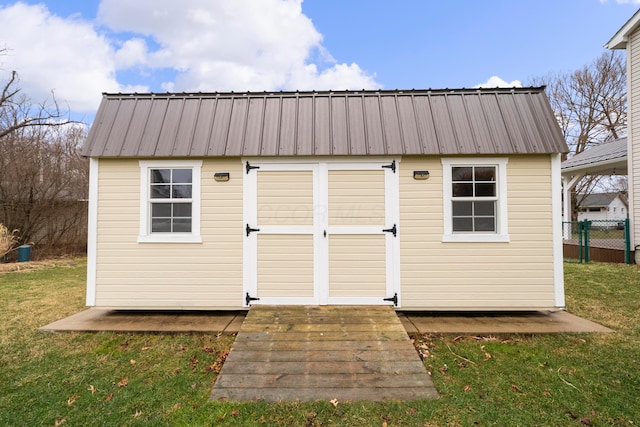 view of shed with fence