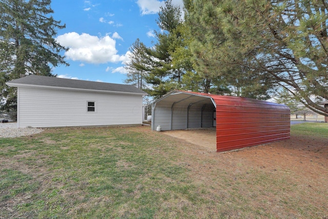 view of outbuilding featuring driveway and a detached carport