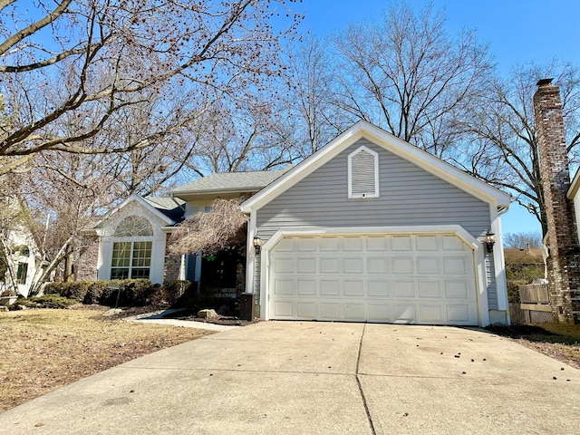 single story home featuring driveway and an attached garage