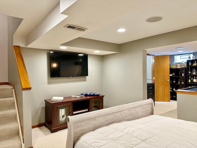 carpeted bedroom featuring recessed lighting, visible vents, and baseboards