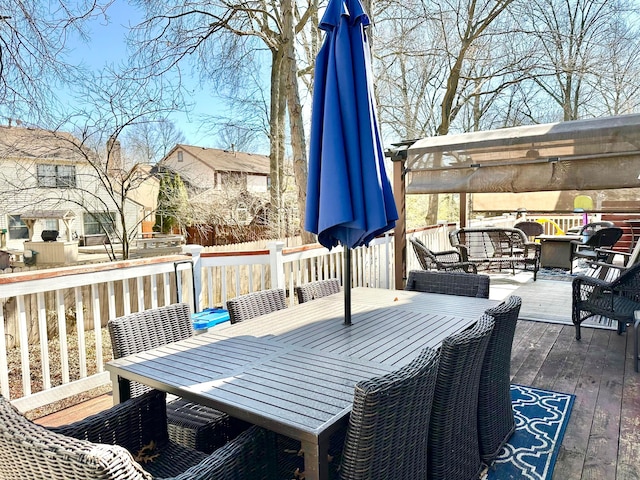 deck featuring outdoor dining area