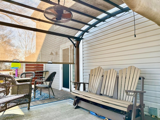 wooden terrace featuring ceiling fan and a pergola