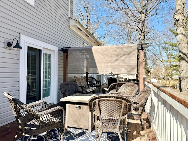 wooden deck featuring an outdoor hangout area