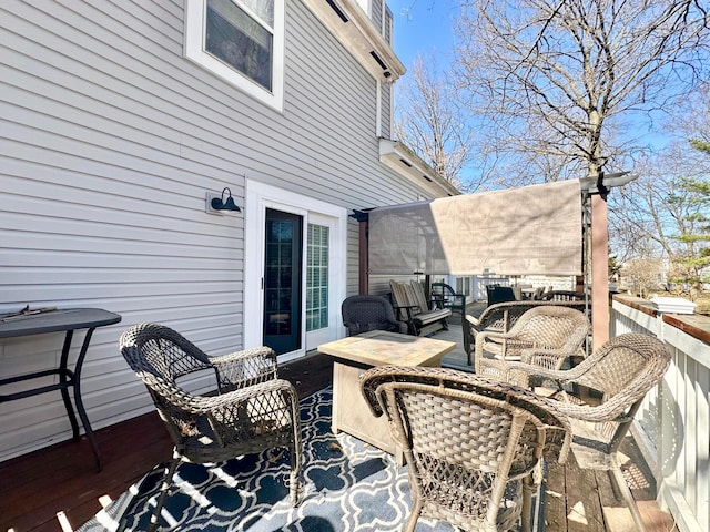 wooden deck featuring an outdoor hangout area