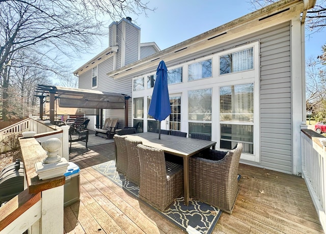 wooden deck featuring outdoor dining area and an outdoor living space