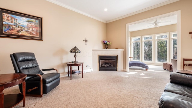 carpeted living room featuring baseboards, ornamental molding, recessed lighting, a glass covered fireplace, and a ceiling fan