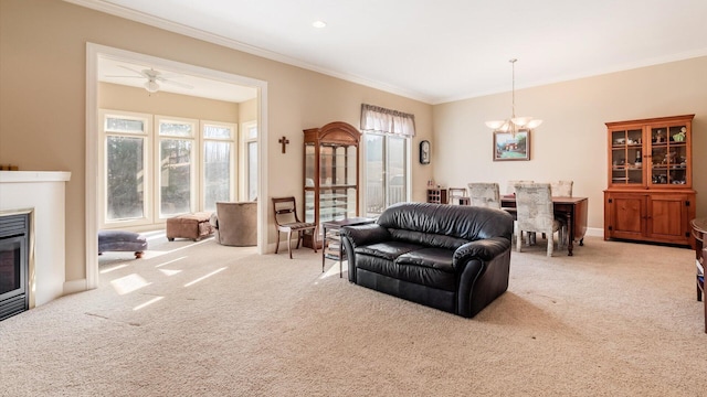 carpeted living room with a glass covered fireplace, crown molding, plenty of natural light, and baseboards
