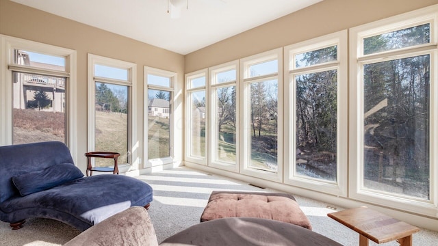 sunroom with a ceiling fan