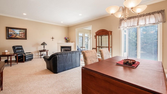 carpeted dining room with plenty of natural light, a notable chandelier, a fireplace, and crown molding