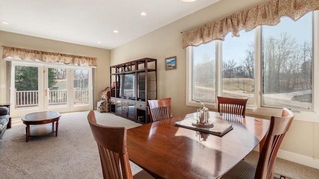 dining area featuring recessed lighting, baseboards, and carpet