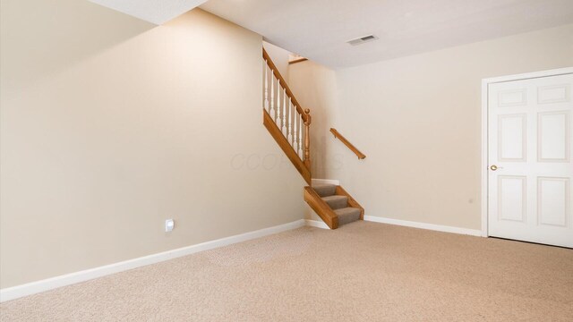interior space featuring visible vents, stairs, and baseboards