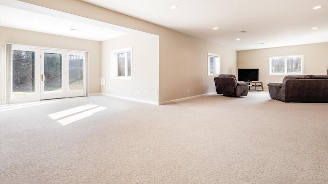 living area featuring recessed lighting, baseboards, and carpet floors