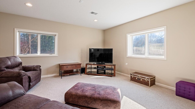carpeted living room featuring recessed lighting, baseboards, and visible vents