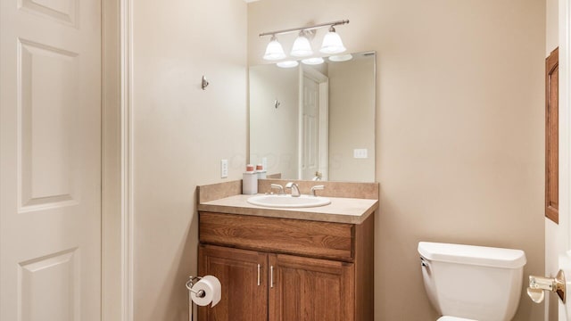 bathroom with toilet and vanity