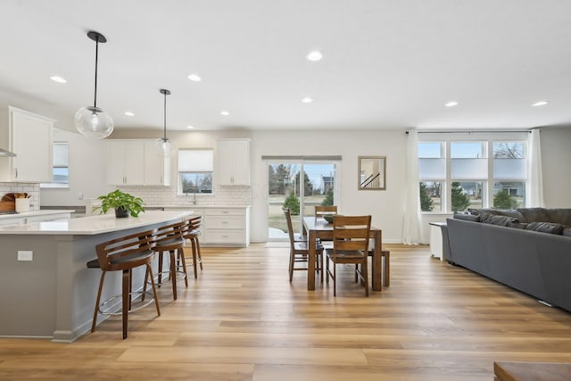 dining room featuring light wood-style floors and recessed lighting