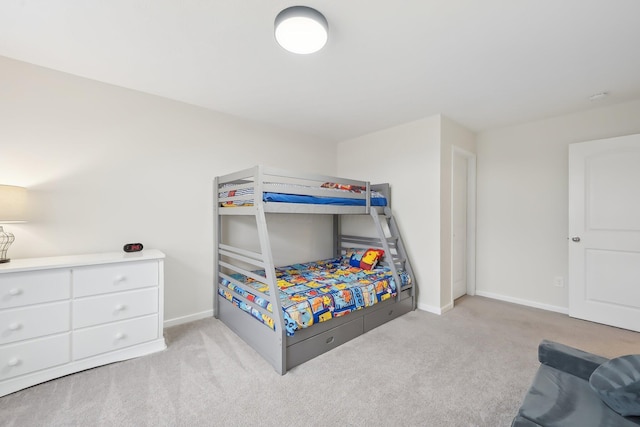 carpeted bedroom with baseboards