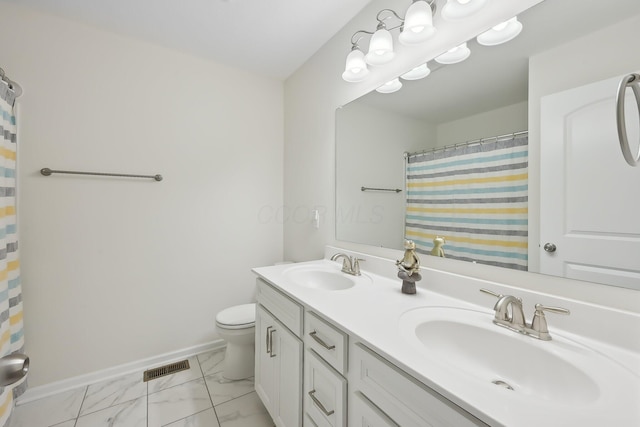 bathroom featuring marble finish floor, baseboards, a sink, and toilet