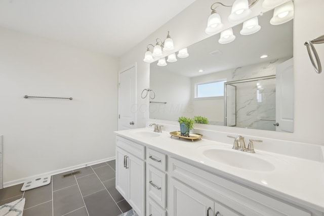 full bath with visible vents, a sink, a marble finish shower, and tile patterned floors