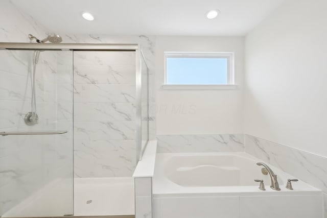 full bathroom with a marble finish shower, a bath, and recessed lighting