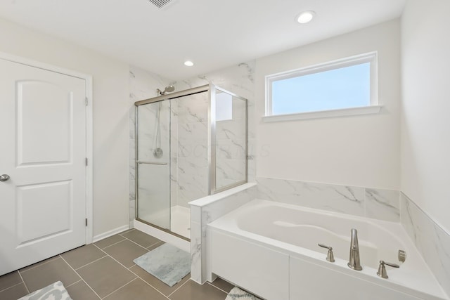 full bath with tile patterned floors, a marble finish shower, a bath, and recessed lighting