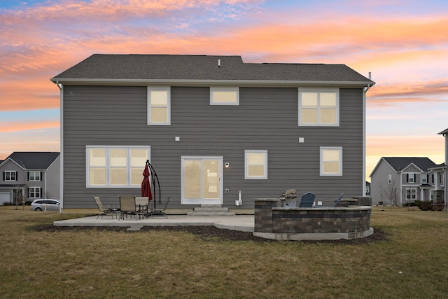 rear view of property featuring entry steps, a patio area, a yard, and central AC unit