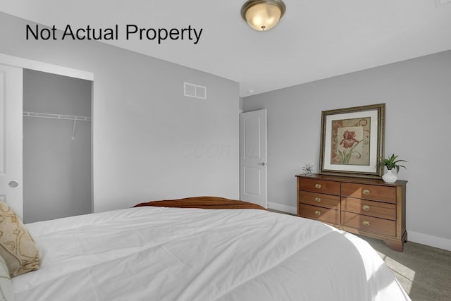 bedroom featuring carpet floors, baseboards, visible vents, and a closet