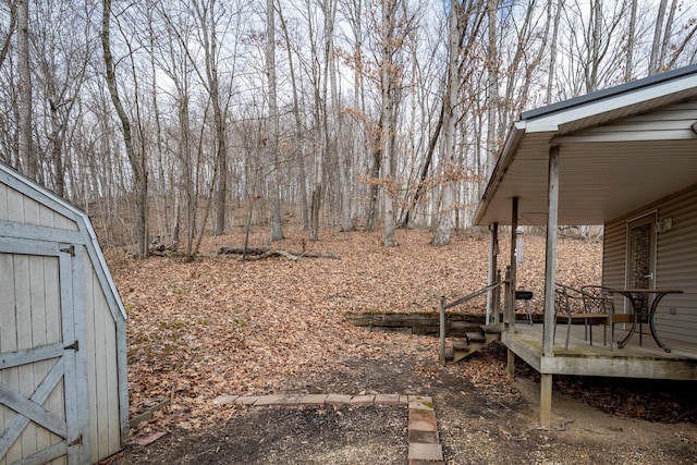 view of yard with a shed and an outdoor structure