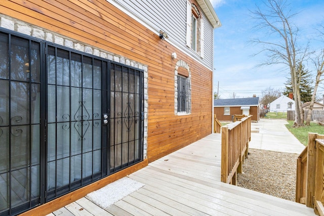 doorway to property featuring a wooden deck