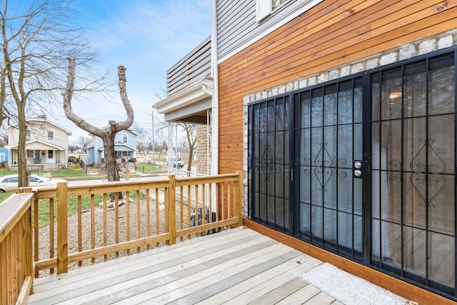 wooden deck with a residential view