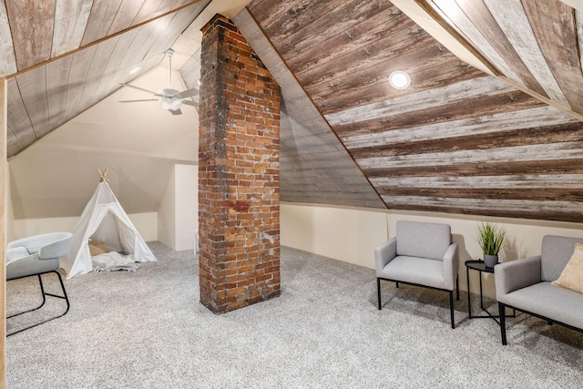 interior space featuring lofted ceiling, carpet, wooden ceiling, and a ceiling fan