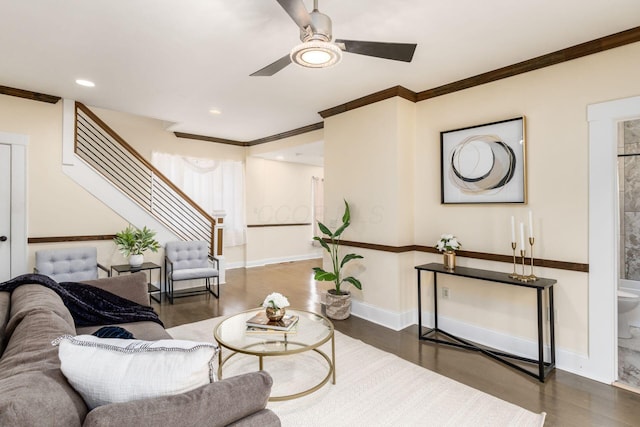 living room with baseboards, wood finished floors, stairs, crown molding, and recessed lighting