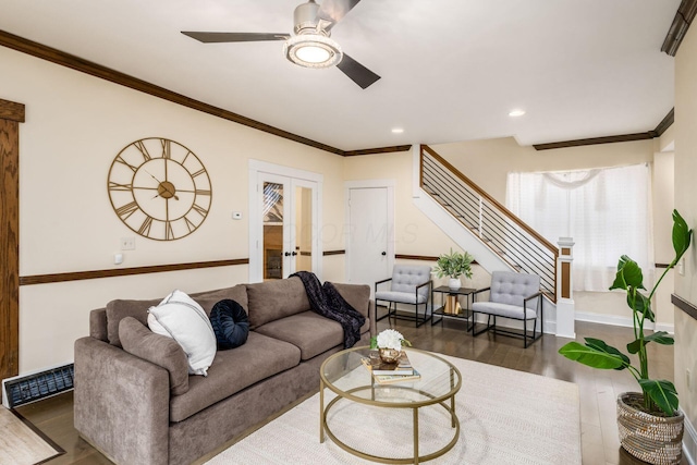 living area featuring visible vents, stairway, wood finished floors, crown molding, and french doors