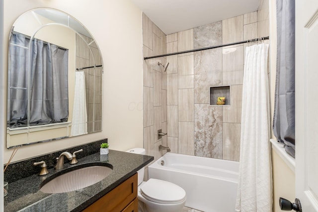 bathroom featuring toilet, shower / tub combo, and vanity