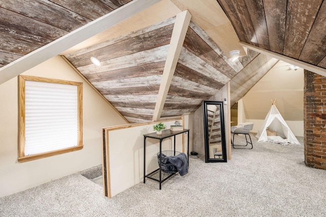 additional living space featuring lofted ceiling, carpet floors, and wood ceiling