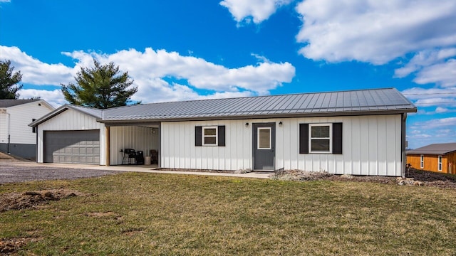 view of front of home featuring a garage, metal roof, a front lawn, and board and batten siding