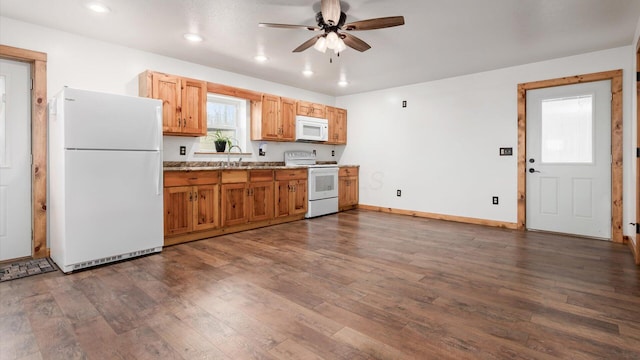 kitchen featuring white appliances, baseboards, a ceiling fan, dark wood-style flooring, and recessed lighting